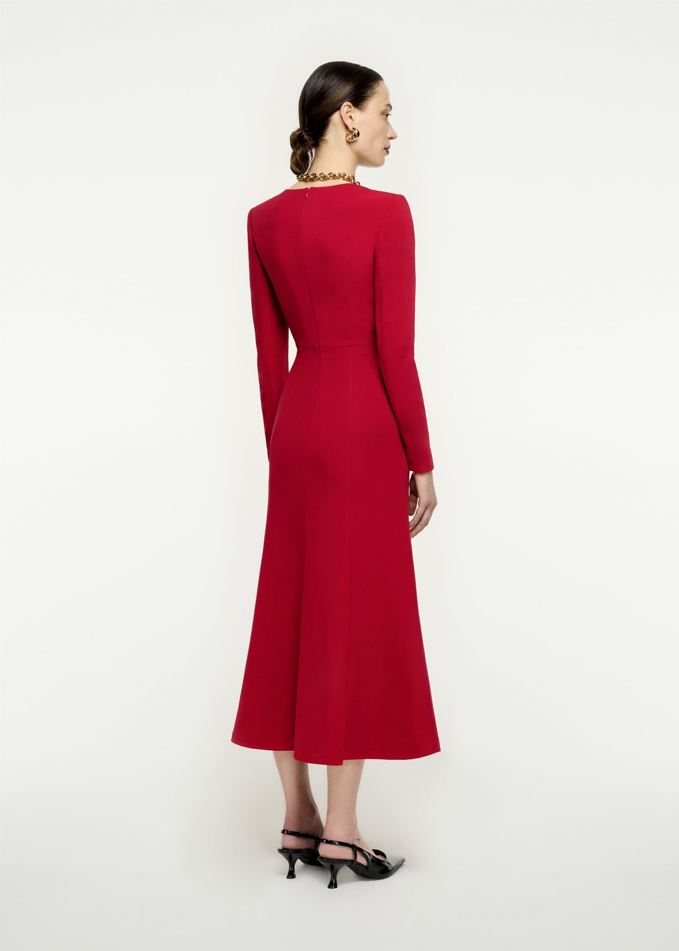 The back of a woman wearing the Long Sleeve Stretch Cady Midi Dress in Red