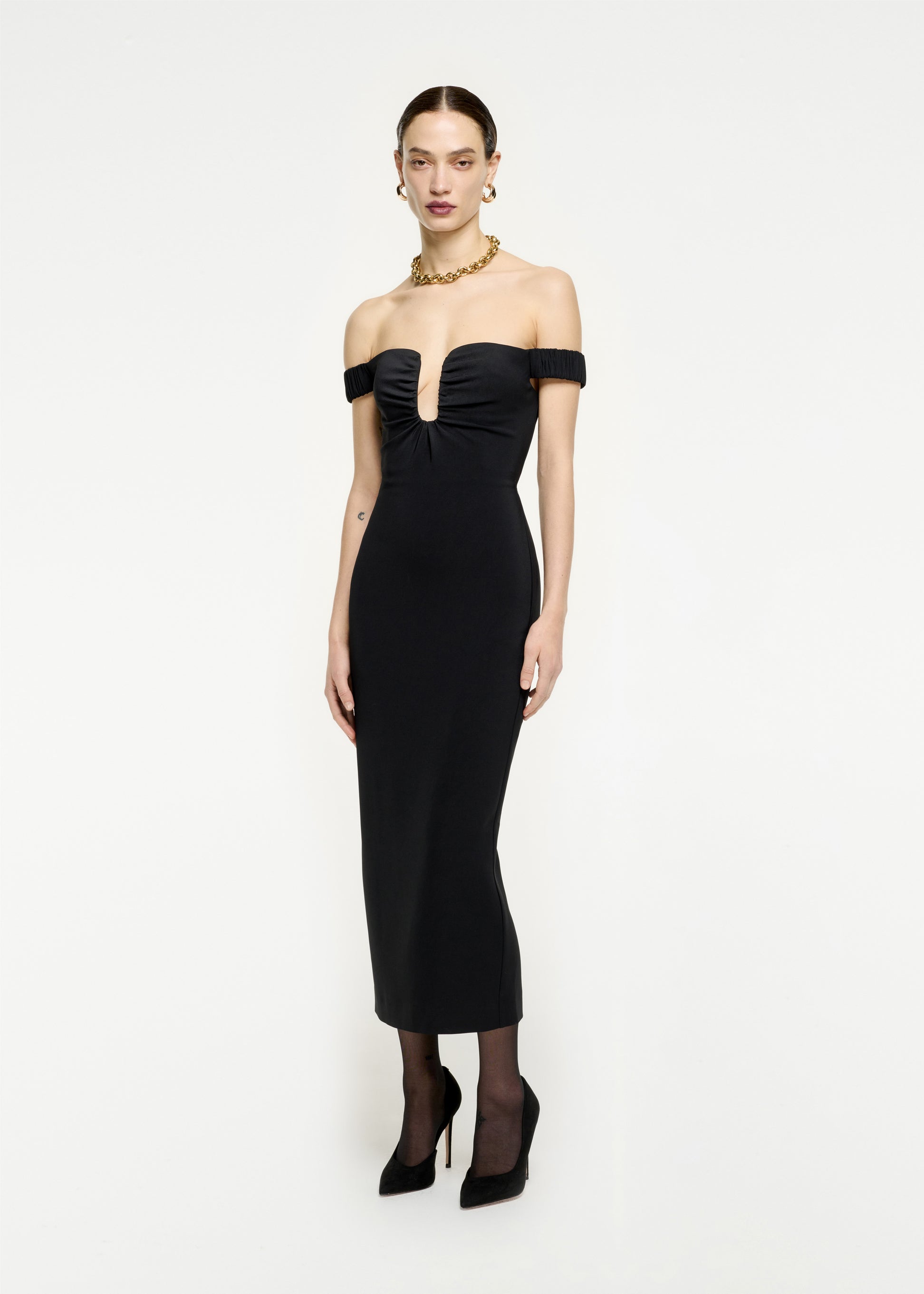 Woman wearing the Off The Shoulder Stretch Cady Midi Dress in Black