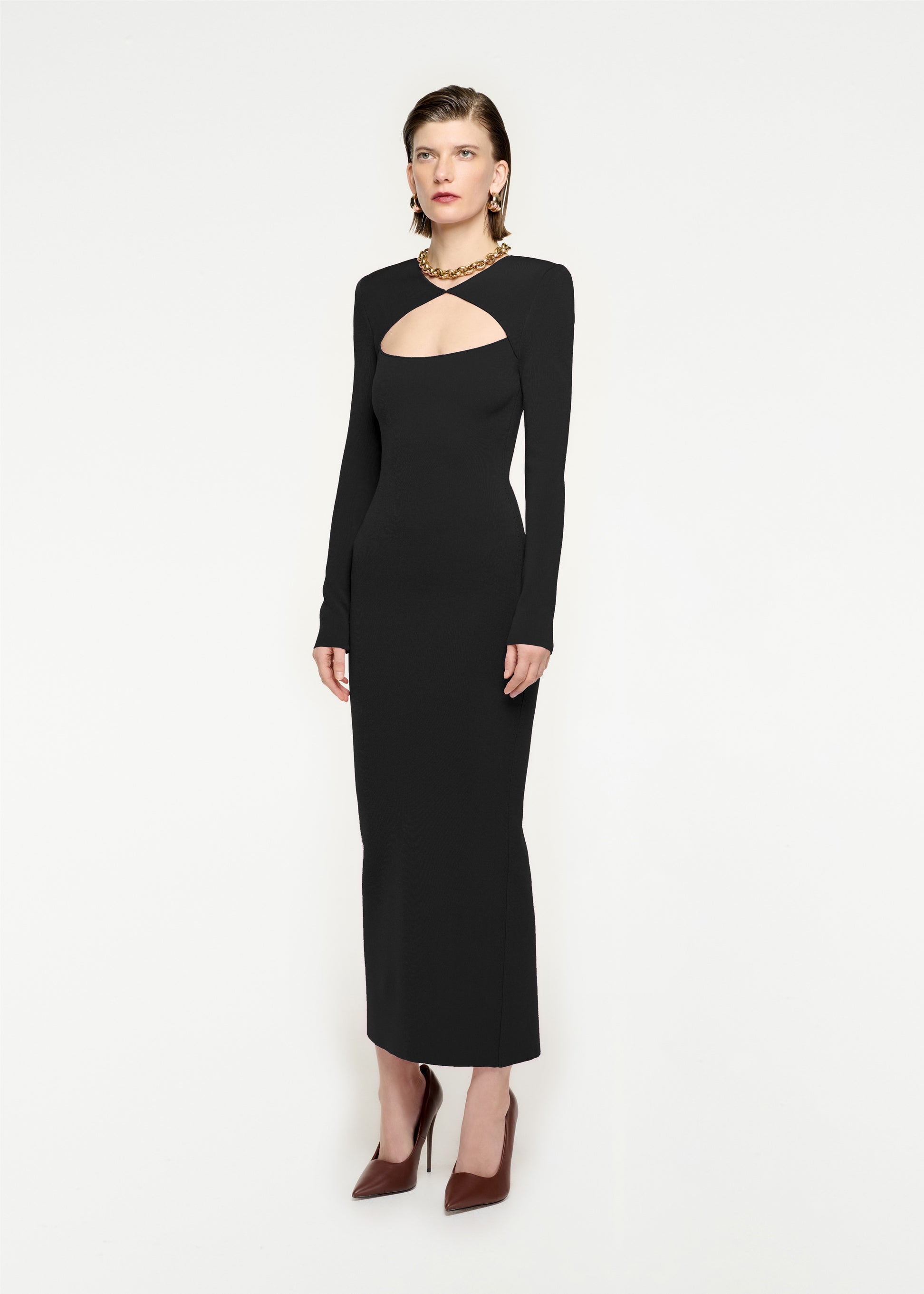 Woman wearing the Long Sleeve Knit Midi Dress in Black