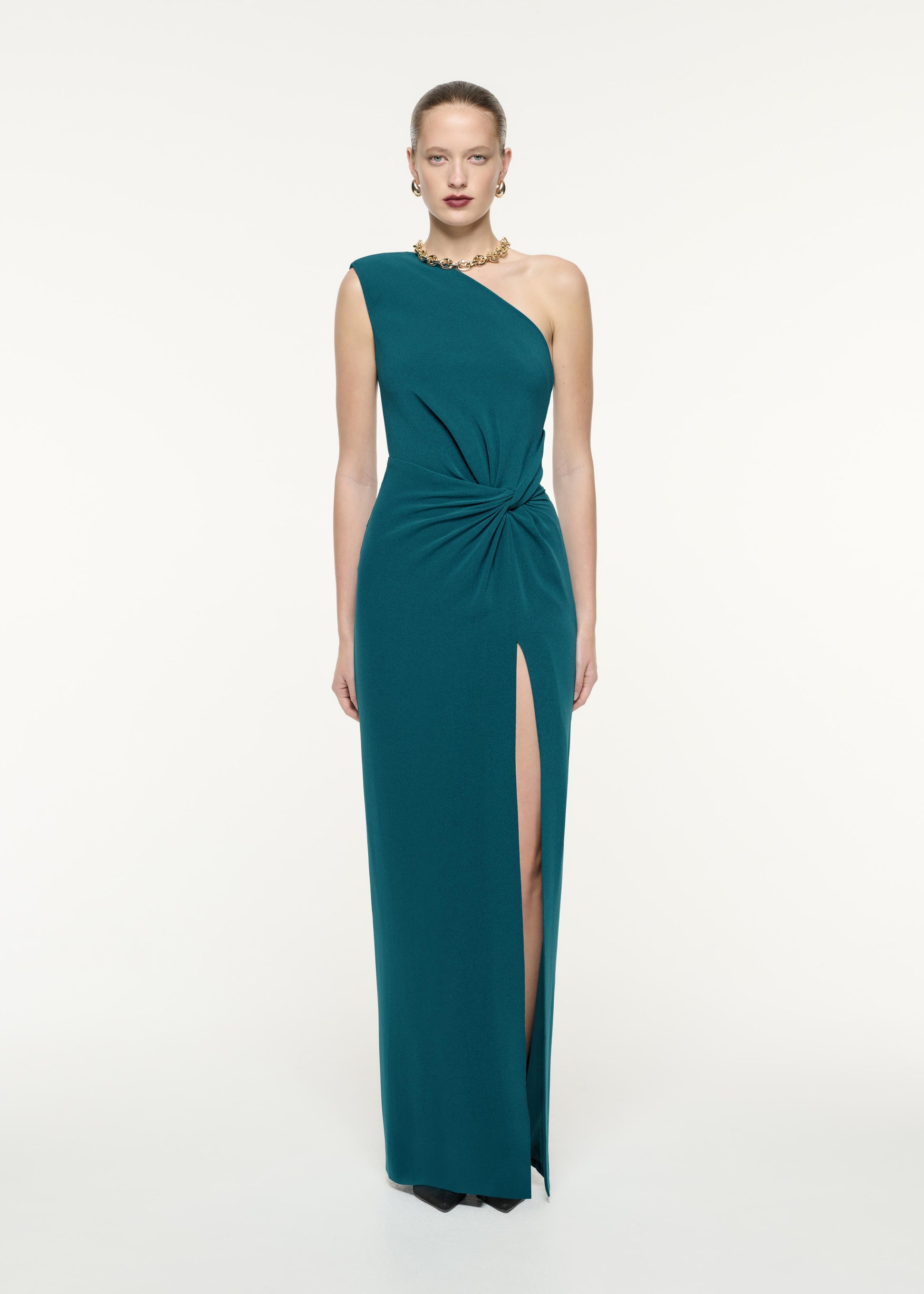 A front view image of a model wearing the Asymmetric Satin Crepe Maxi Dress in Green