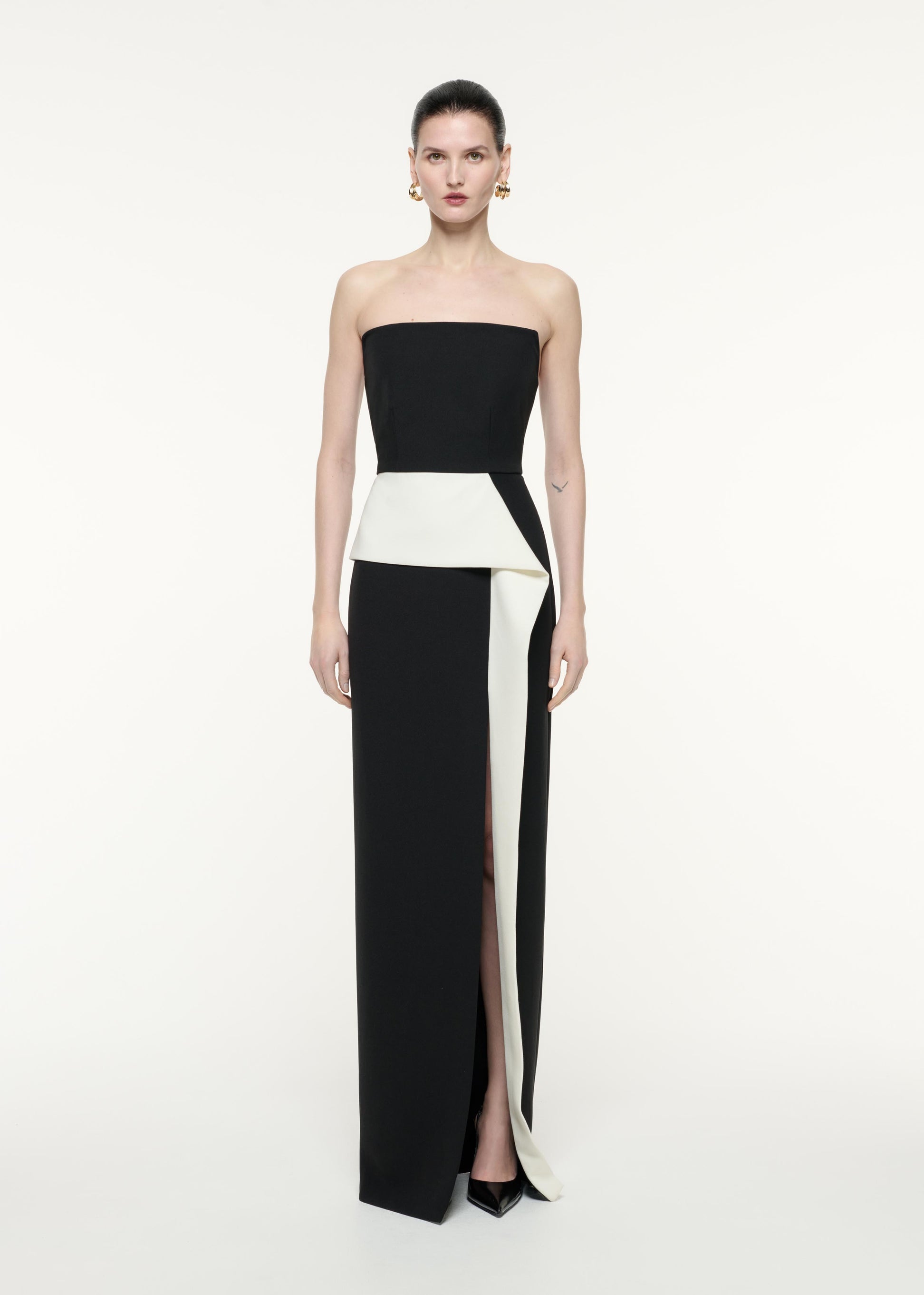 A front view image of a model wearing the Strapless Crepe Gown in Monochrome