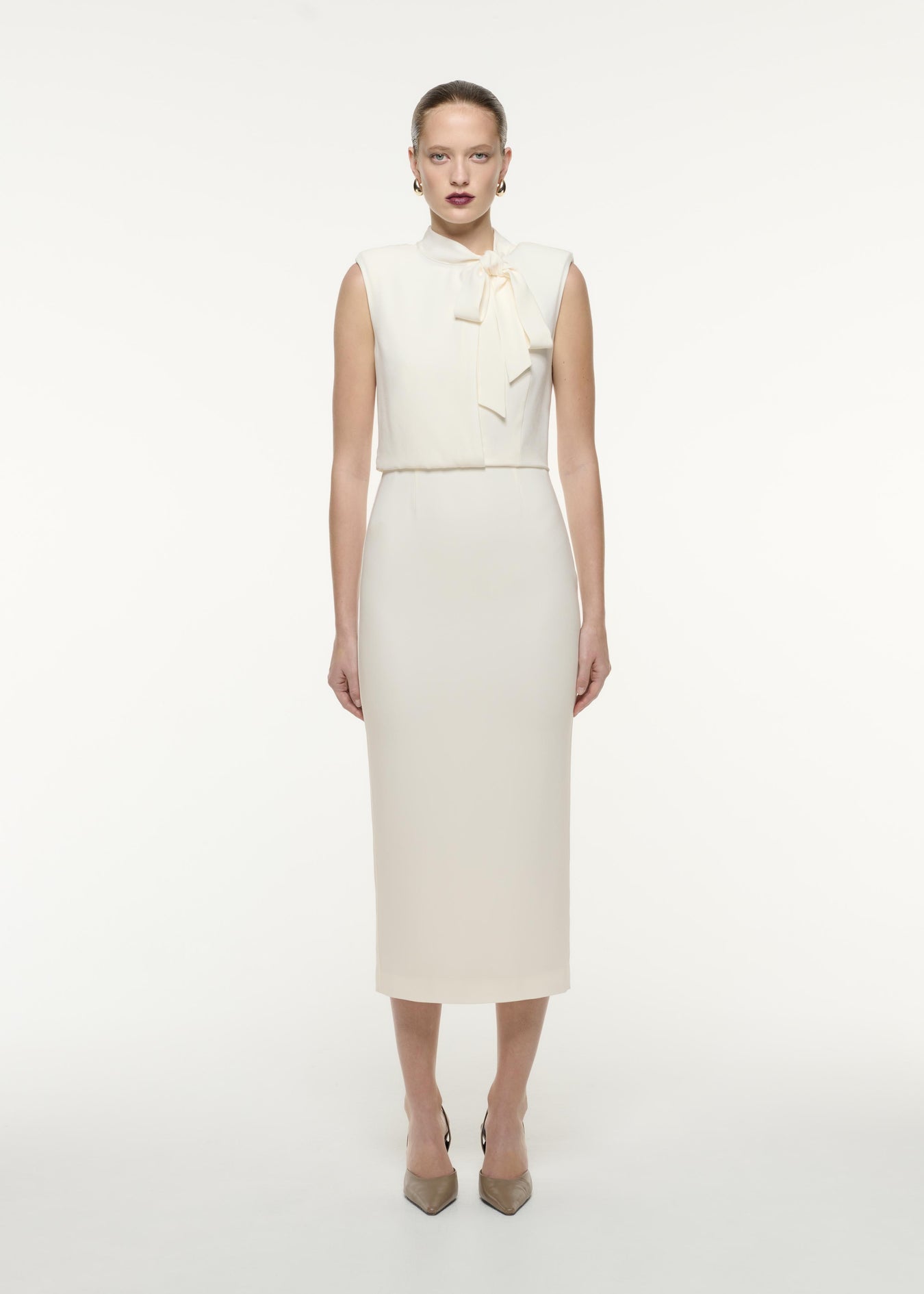 A front view image of a model wearing the Satin Crepe Midi Dress in Cream