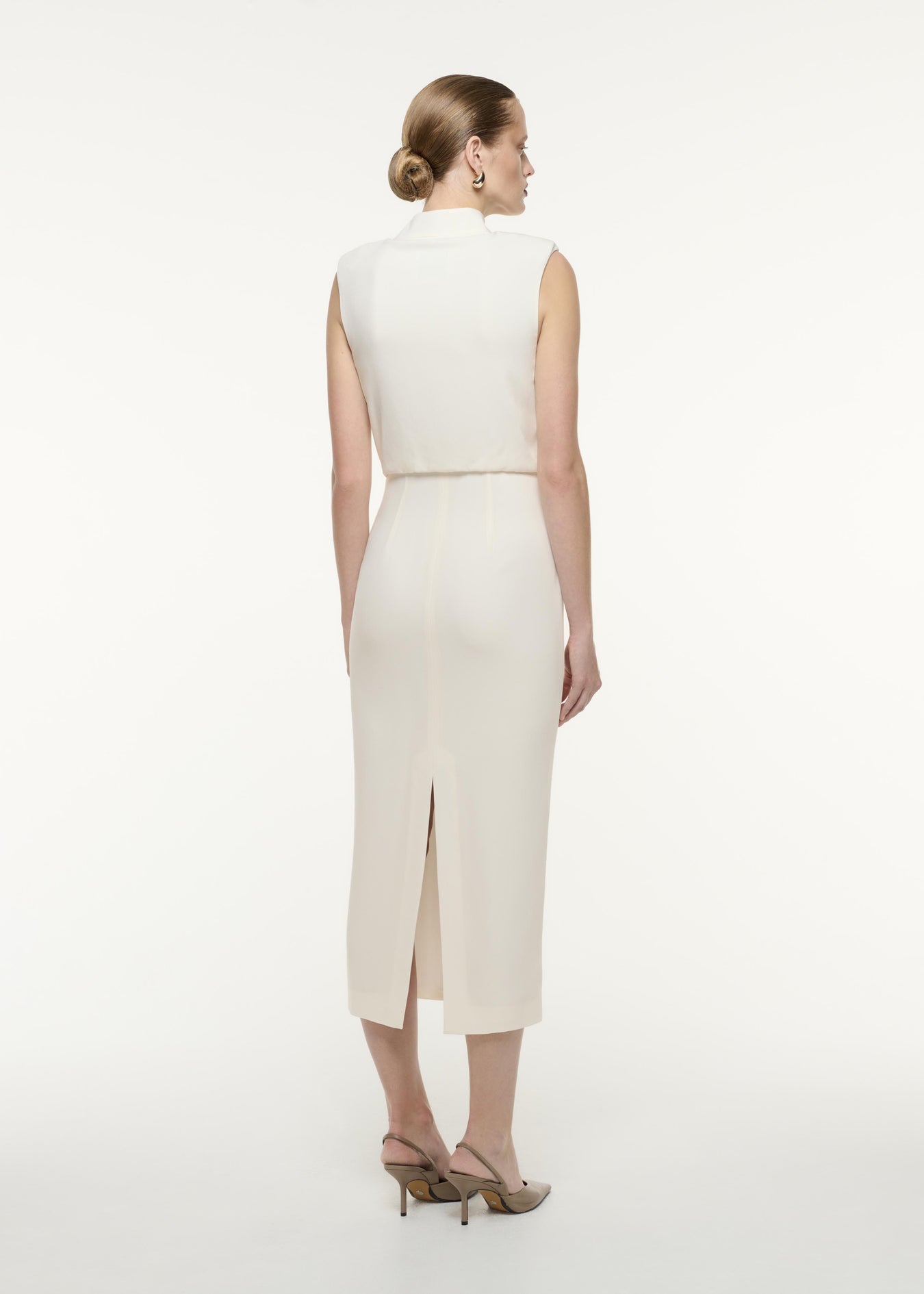 A back view image of a model wearing the Satin Crepe Midi Dress in Cream
