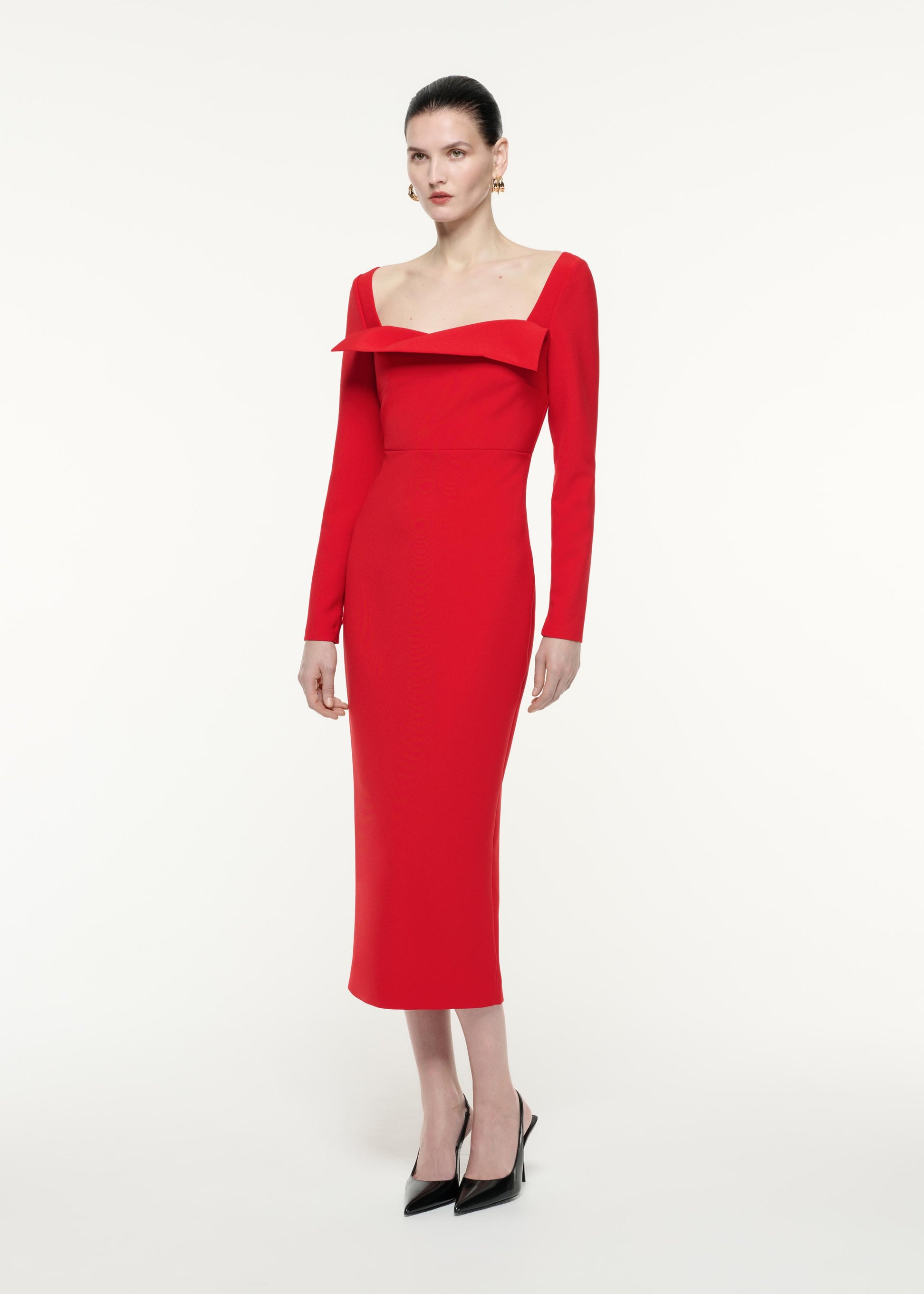 A side view image of a model wearing the Long Sleeve Crepe Midi Dress in Red