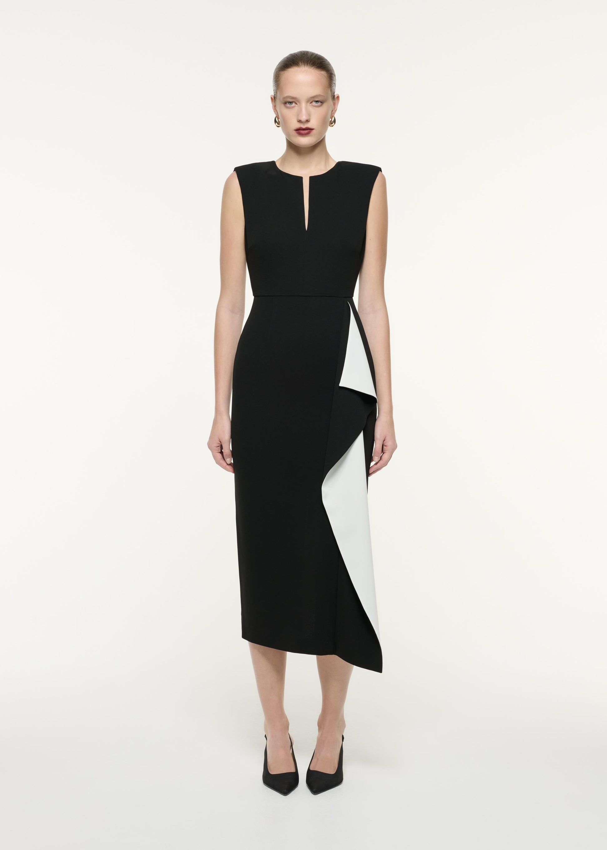 A front view image of a model wearing the Heavy Cady Ruffle Midi Dress in Monochrome