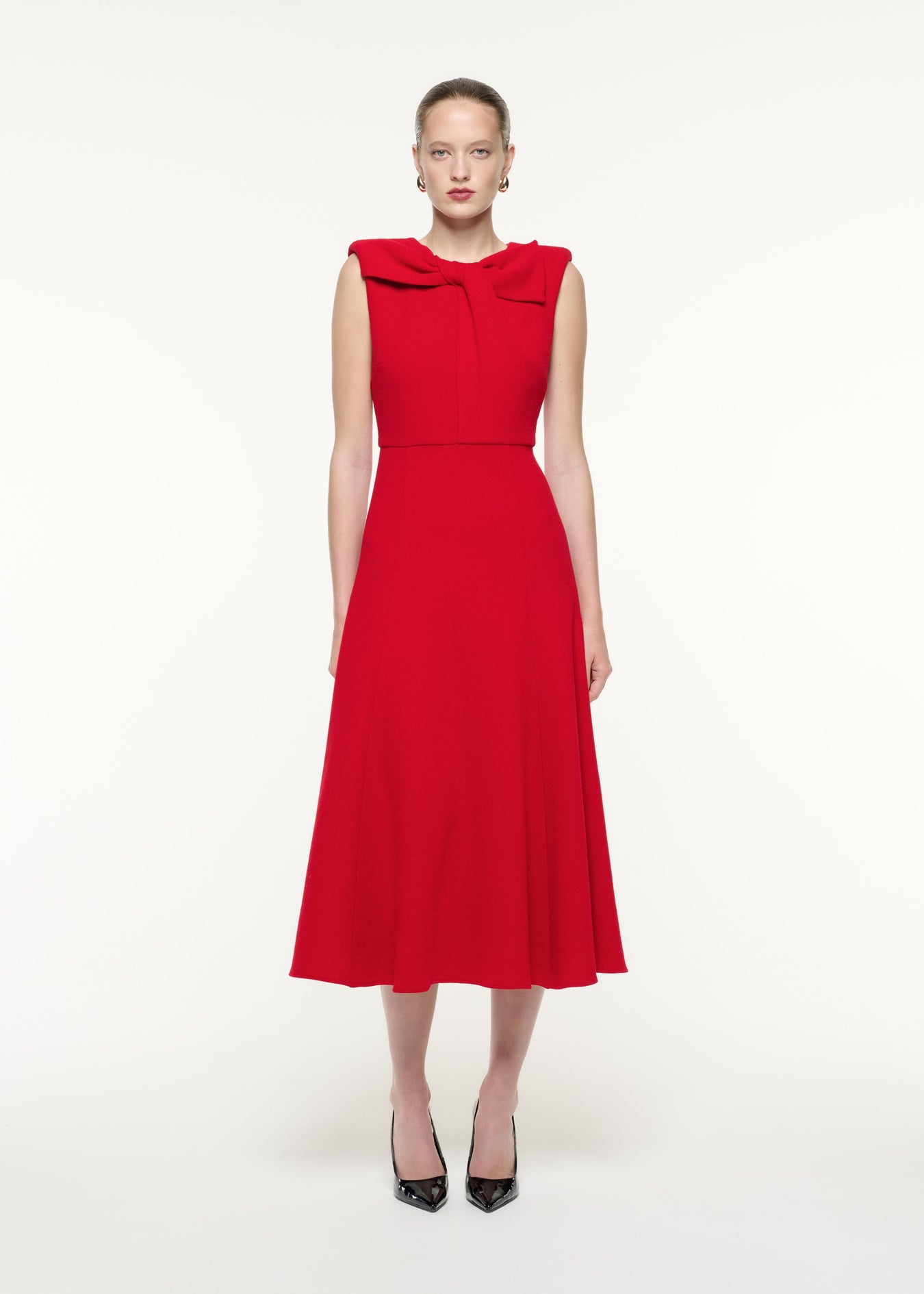 A front view image of a model wearing the Wool Crepe Midi Dress in Red