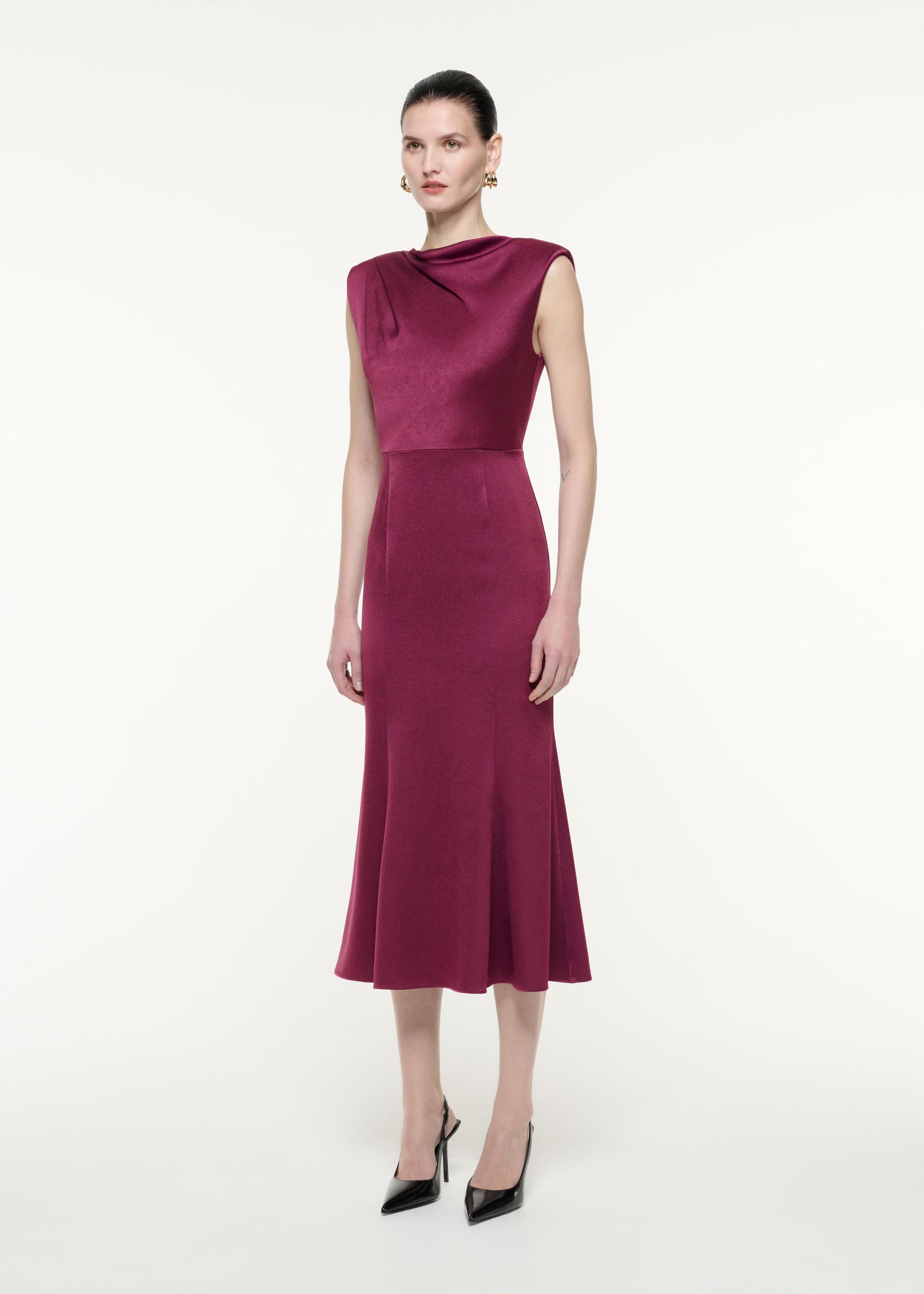 A side view image of a model wearing the Satin Crepe Midi Dress Purple in Purple