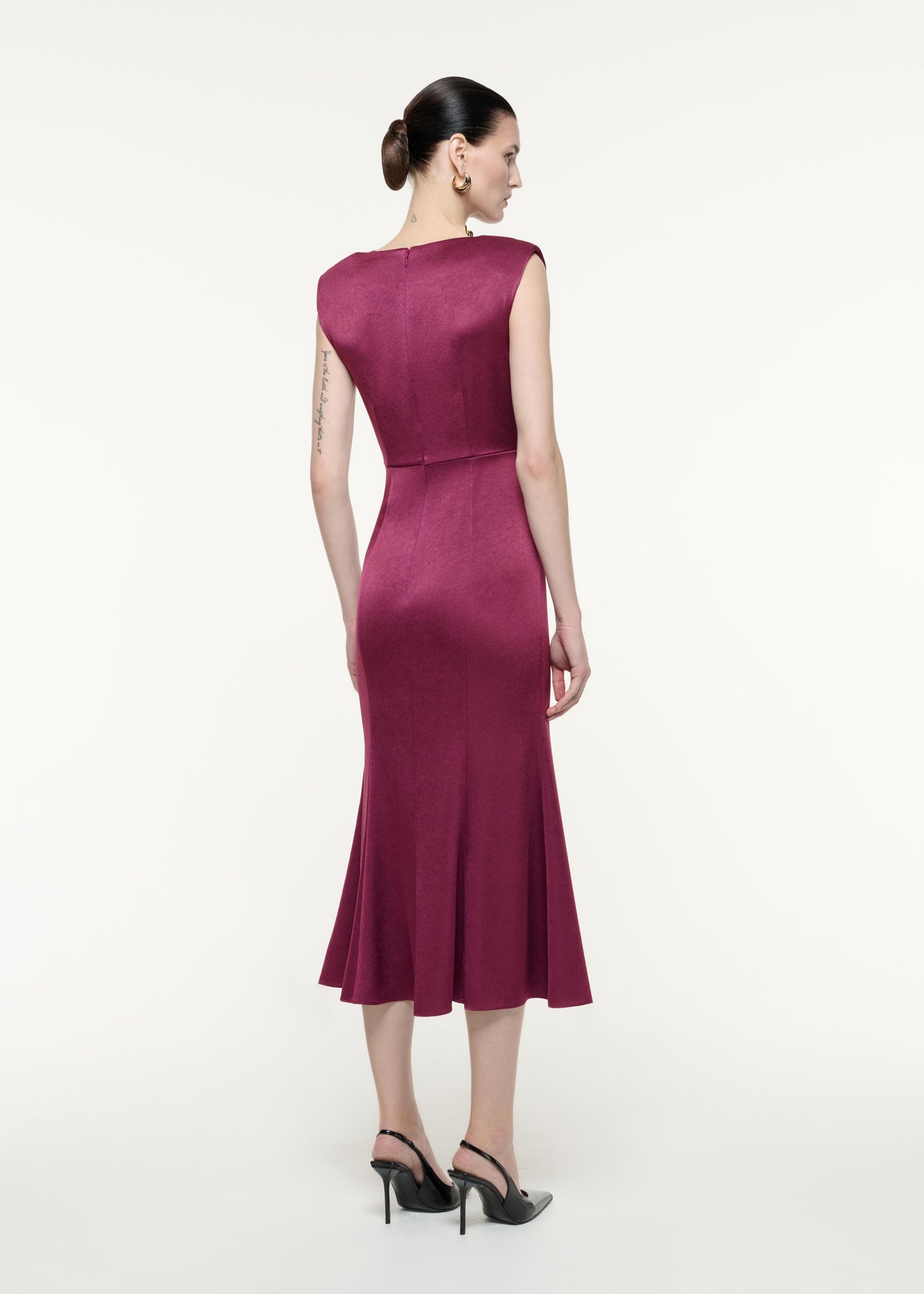 A back view image of a model wearing the Satin Crepe Midi Dress Purple in Purple