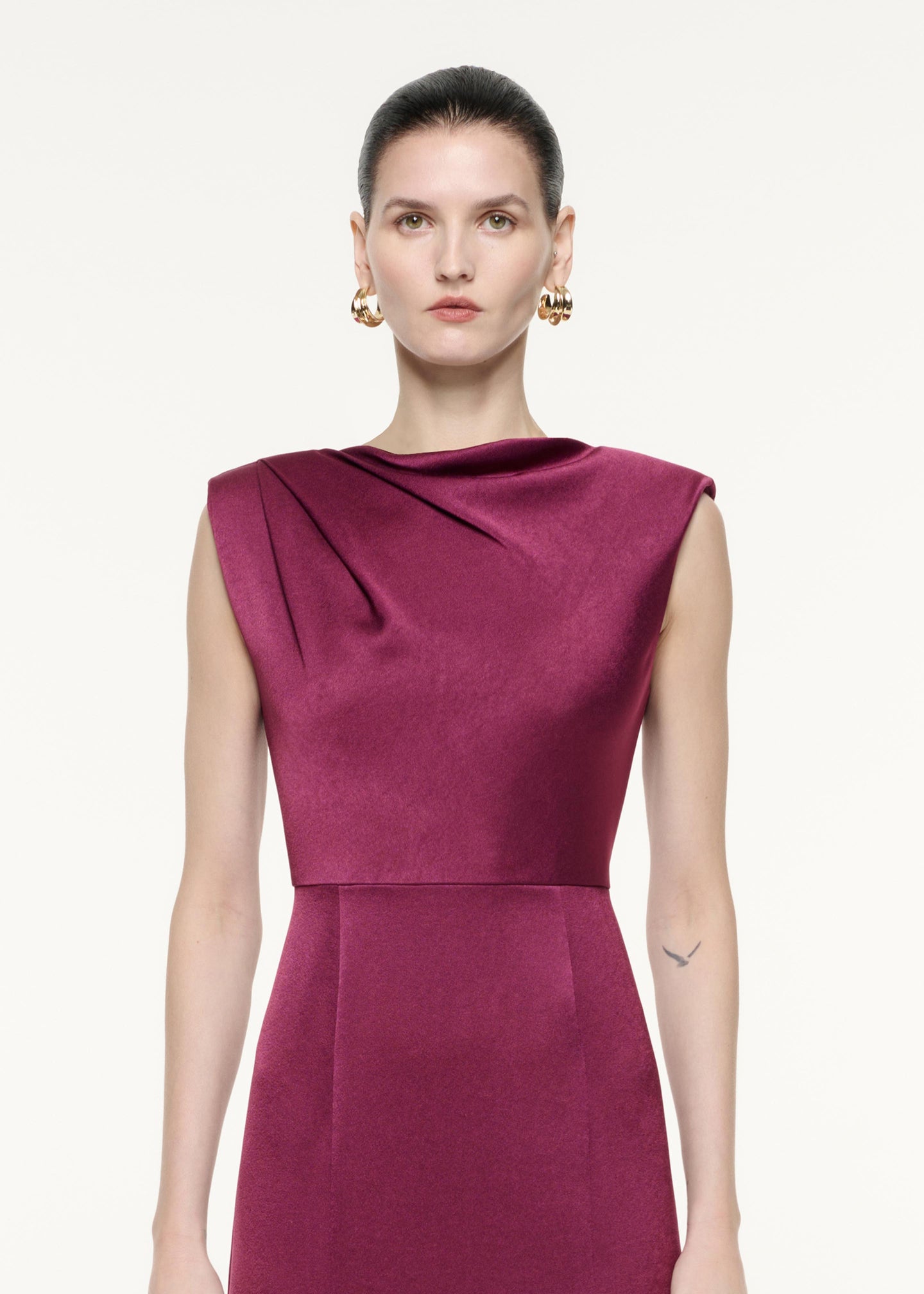 A close up image of a model wearing the Satin Crepe Midi Dress Purple in Purple