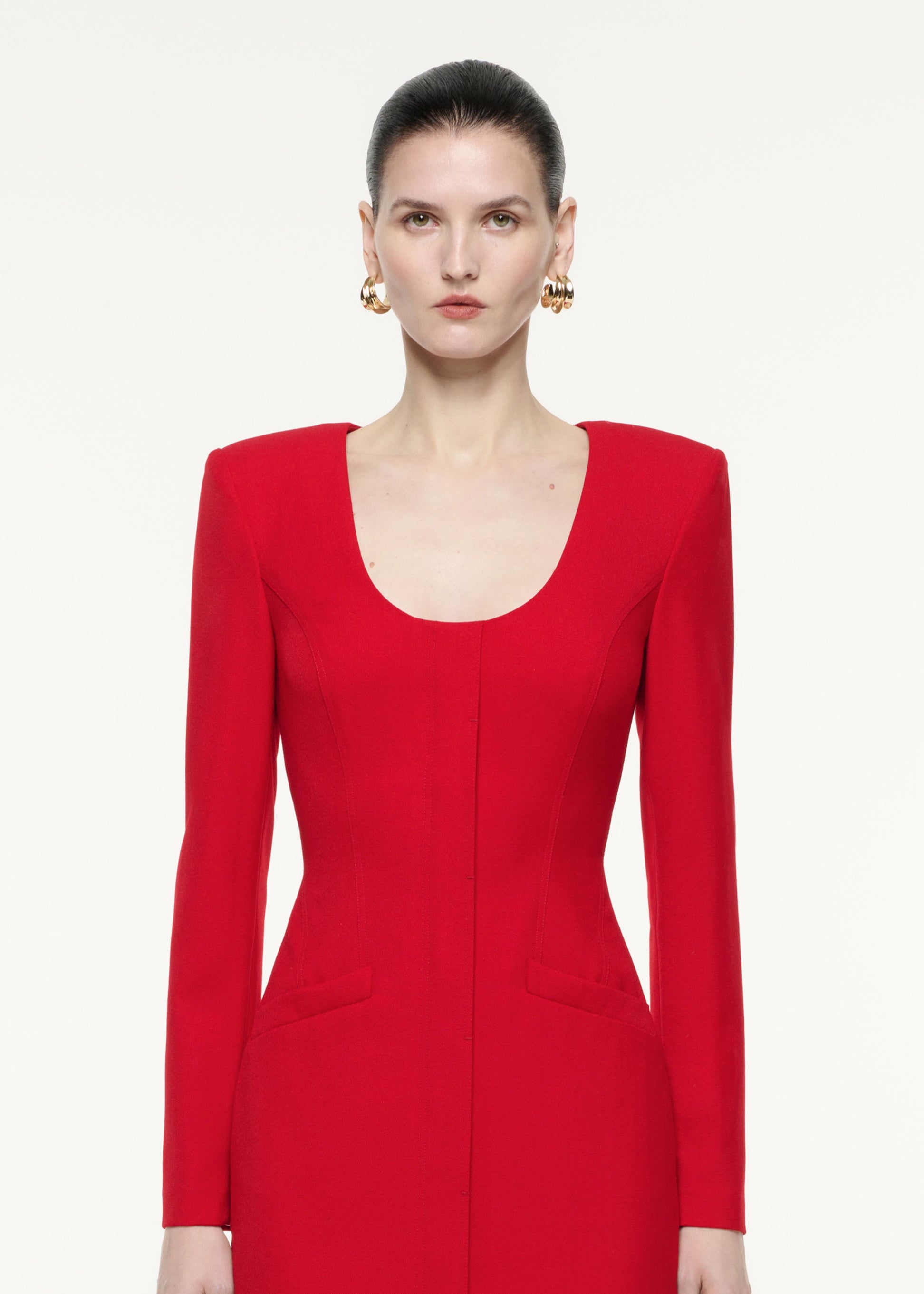 A close up image of a model wearing the Long Sleeve Tailoring Wool Mini Dress in Red