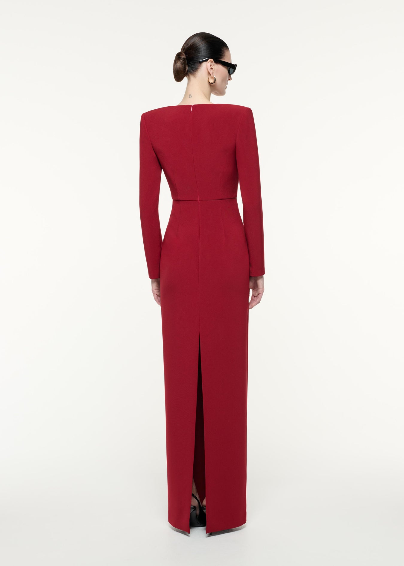 A back view image of a model wearing the Long Sleeve Crepe Maxi Dress in Red