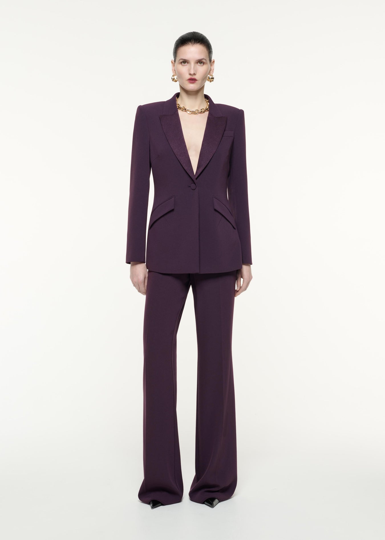 A front view image of a model wearing the Satin Crepe Jacket in Aubergine