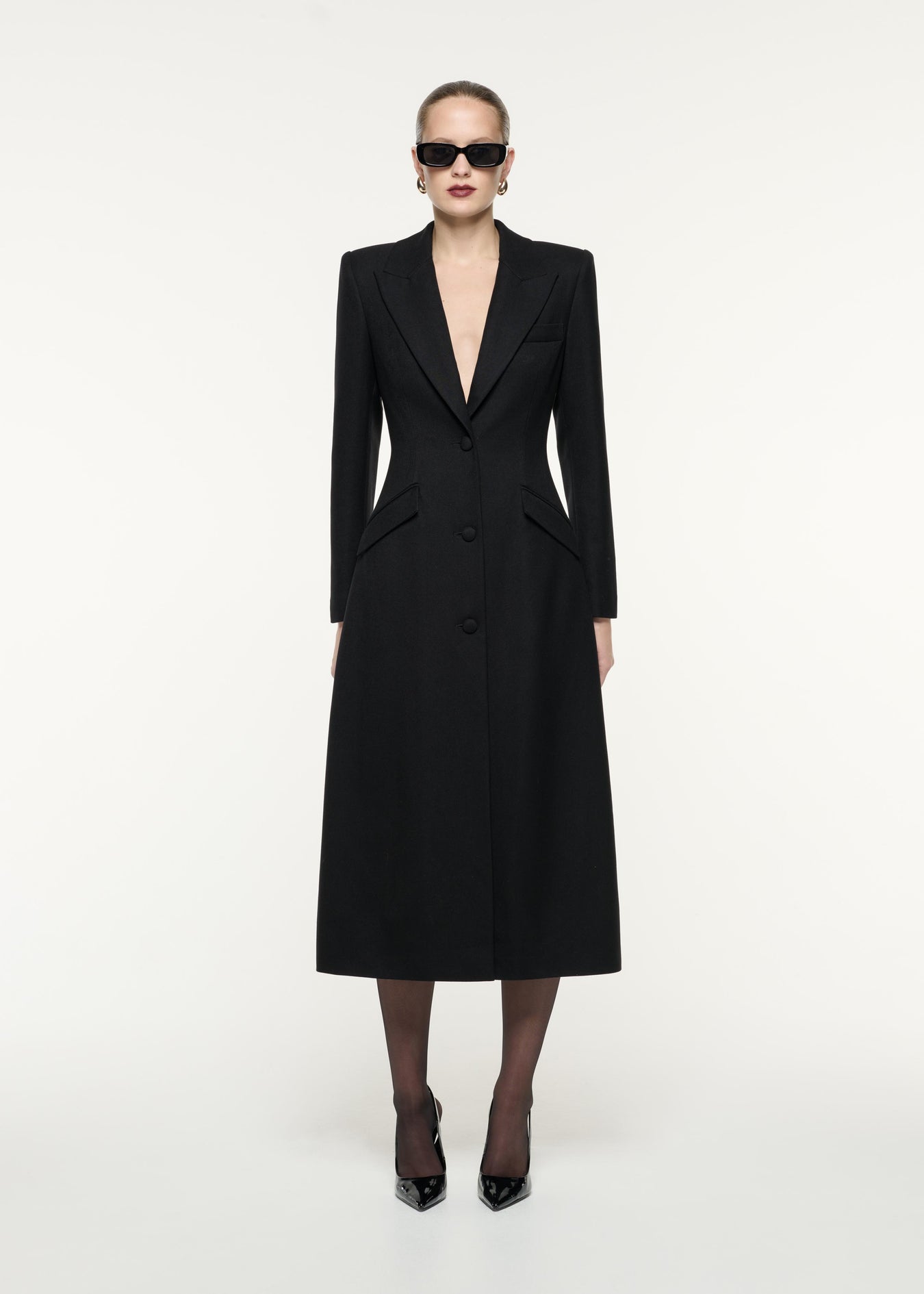 A front view image of a model wearing the Wool Twill Tailored Coat in Black
