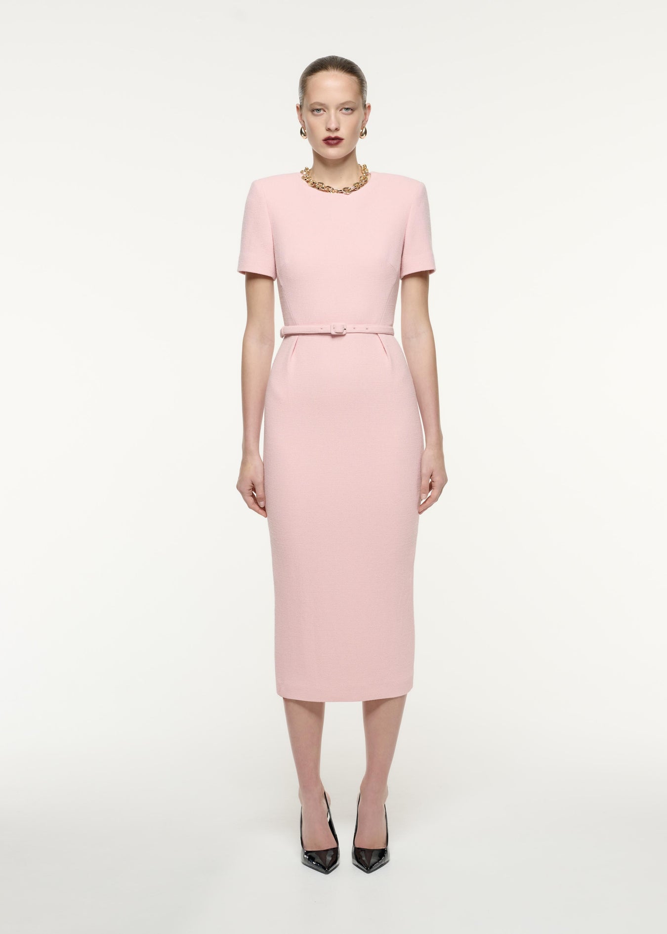 A front view image of a model wearing the Short Sleeve Wool Crepe Midi Dress in Pink