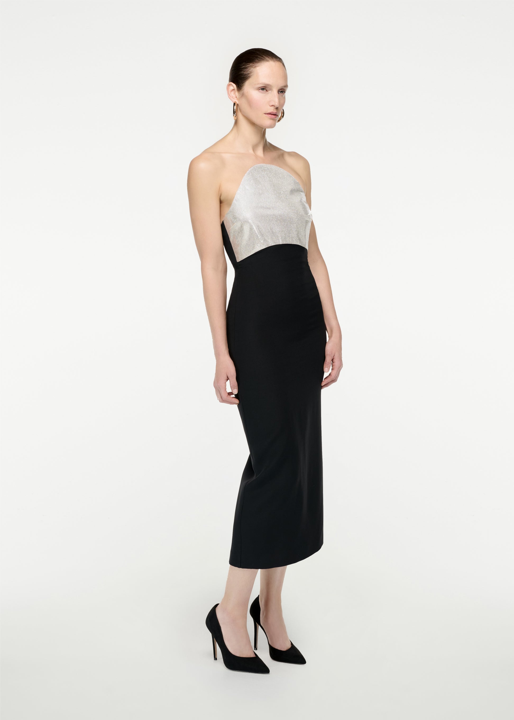 Woman wearing the Strapless Silk Wool Diamante Midi Dress in Black