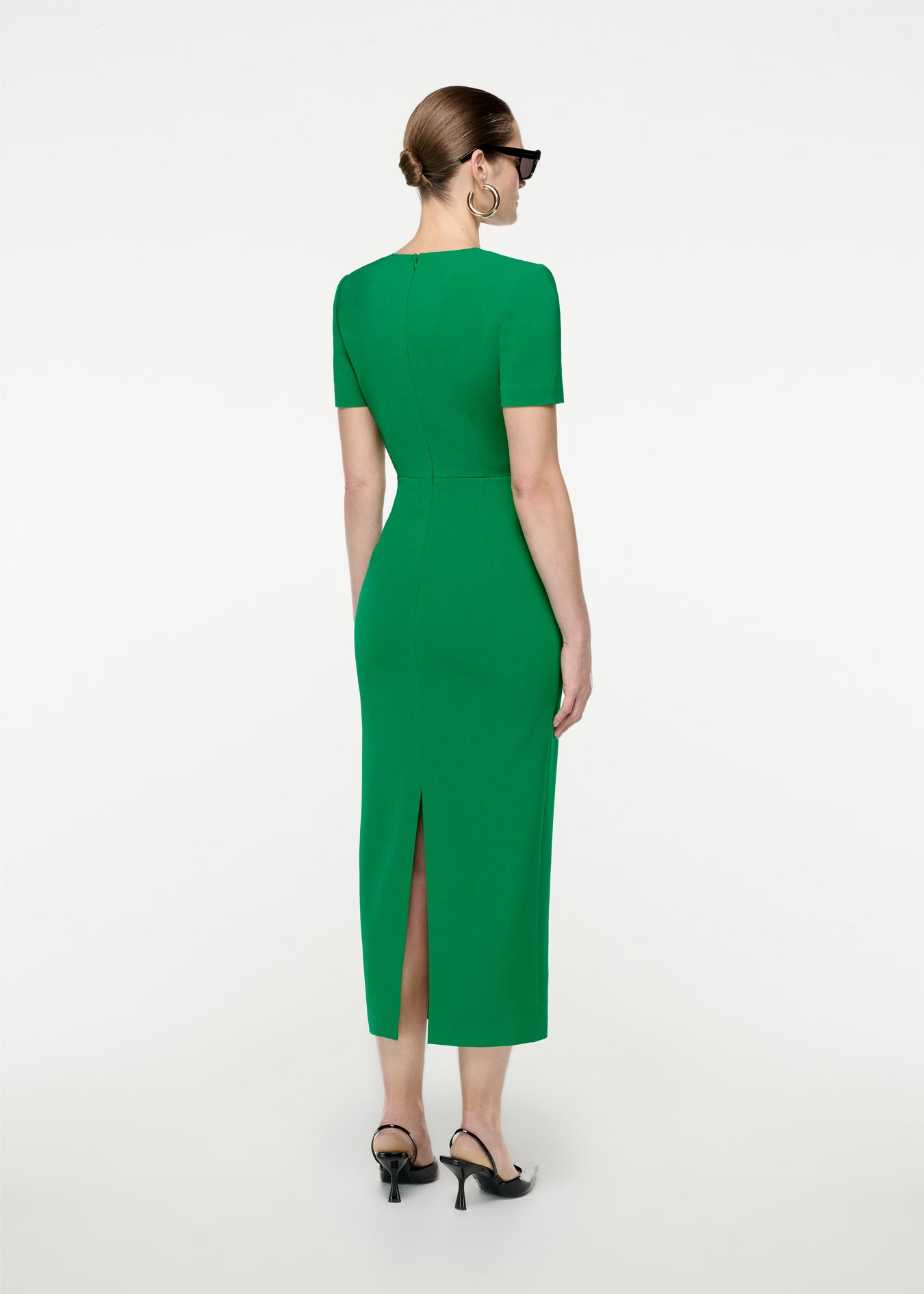 The back of a woman wearing the Short Sleeve Stretch Cady Midi Dress in Green