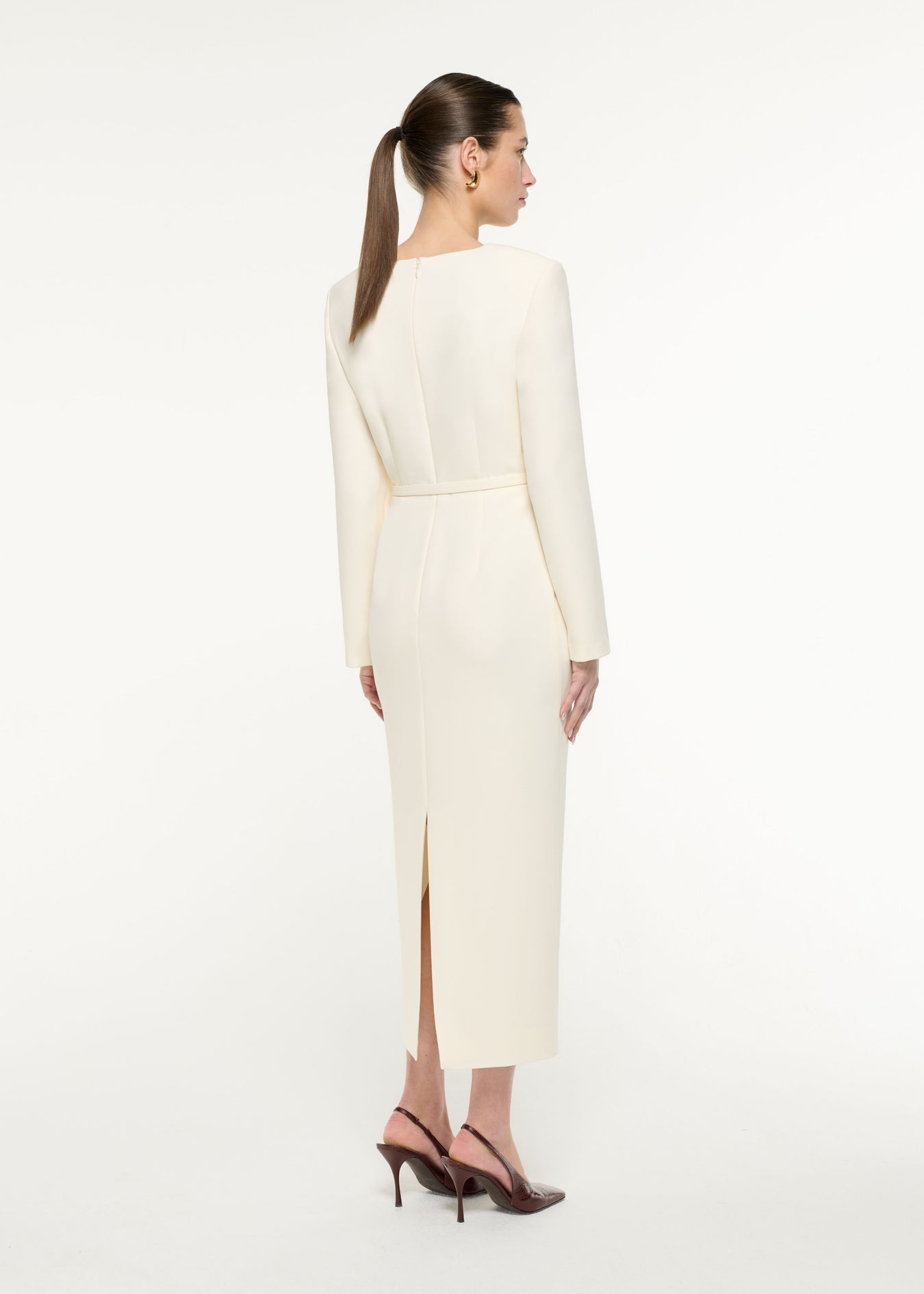 Back view of a model wearing the Tri-fold drape Midi Dress in Cream