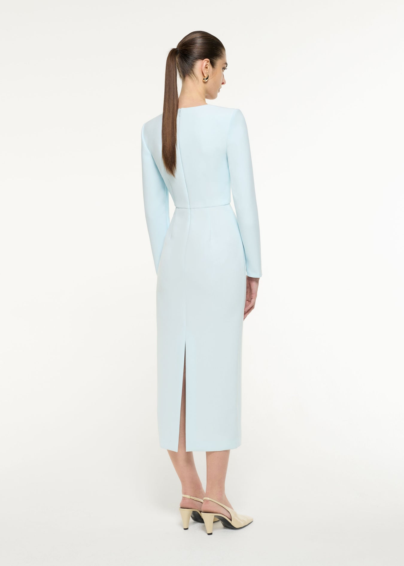 Back view of a model wearing the Tri-fold Drape Midi Dress in Blue