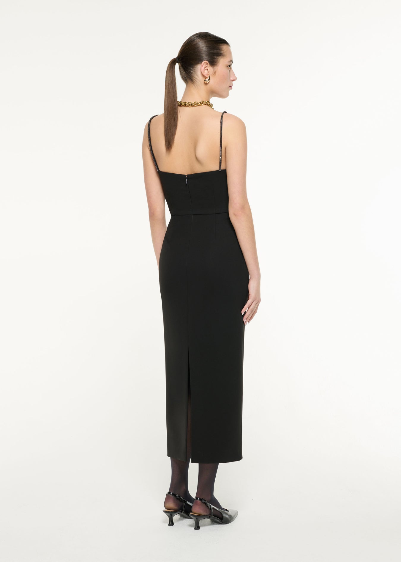 Back view of a model wearing the Diamante Strap Crepe Midi Dress in Black