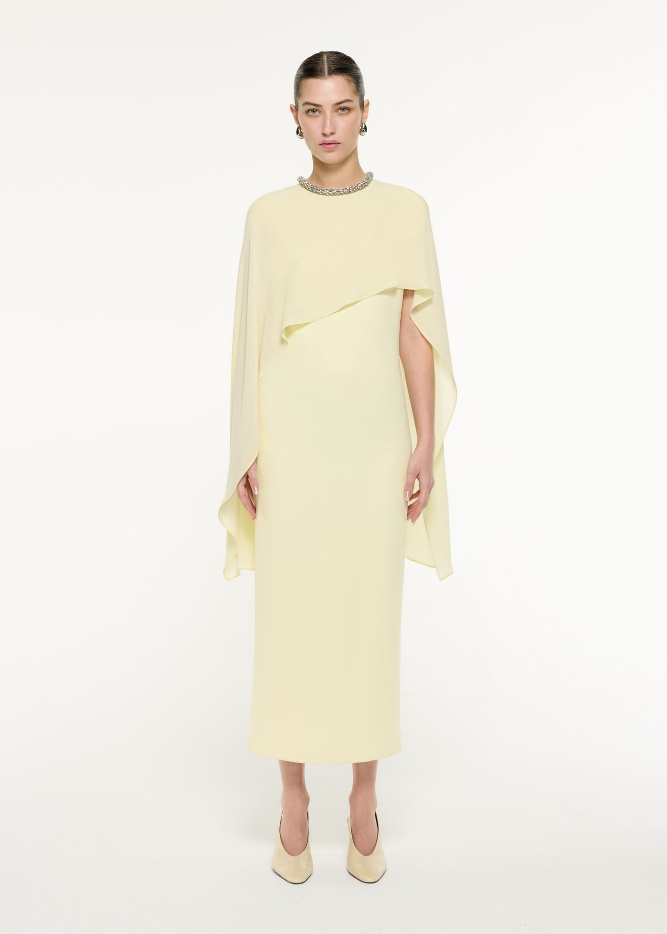 Front view of a model wearing the Silk Cape Maxi Dress in Light Yellow