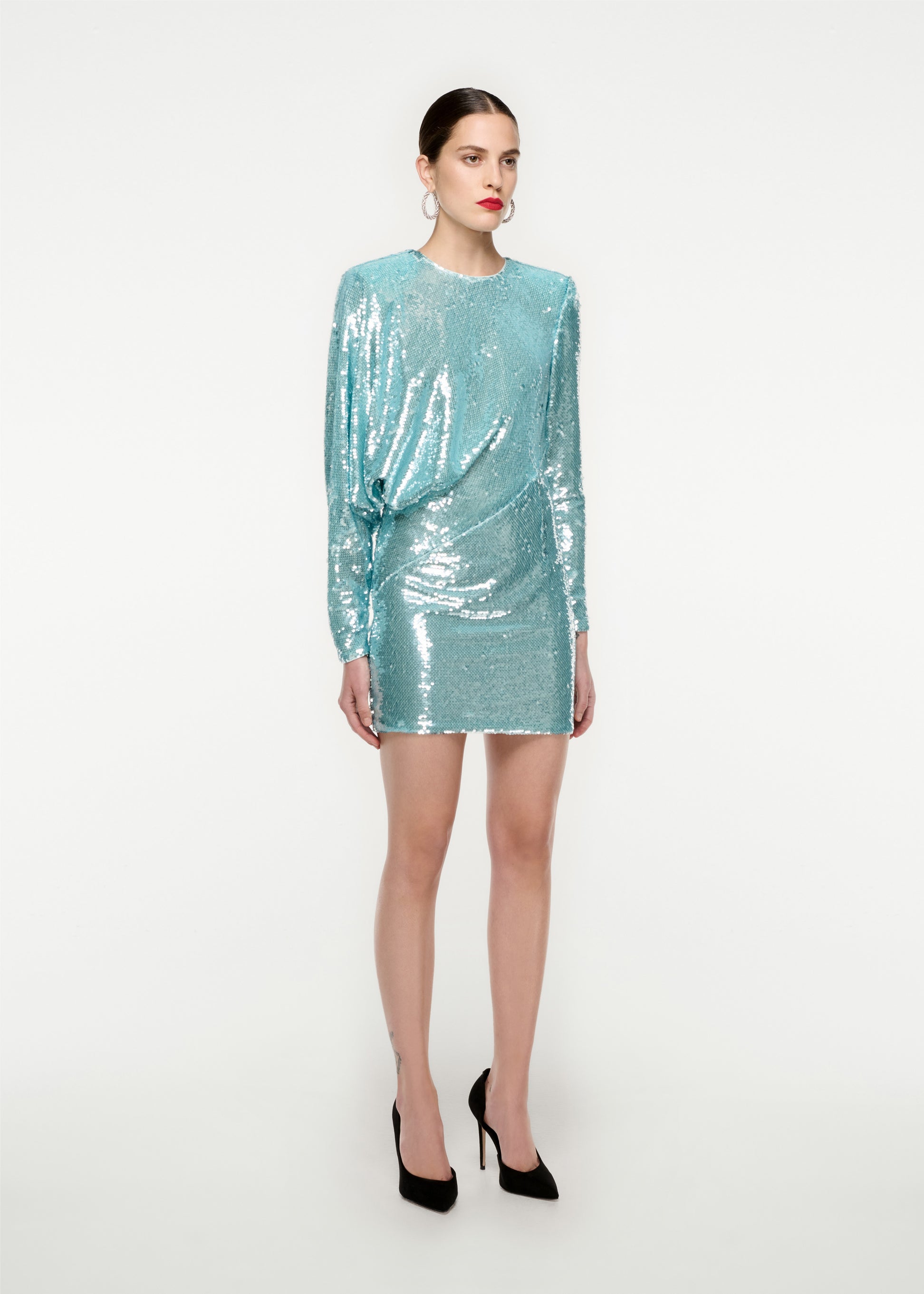 Woman wearing the Long Sleeve Sequin Mini Dress in Blue