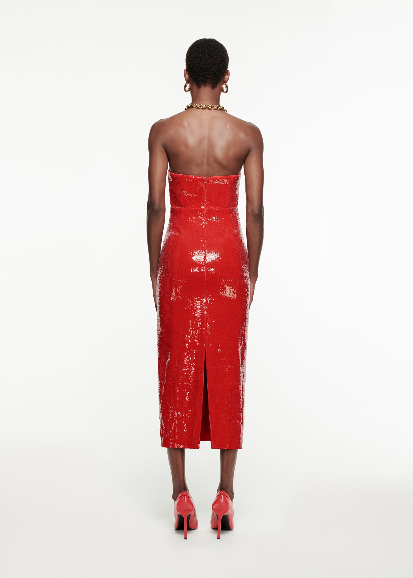 The back of a woman wearing the Strapless Sequin Midi Dress in Red 