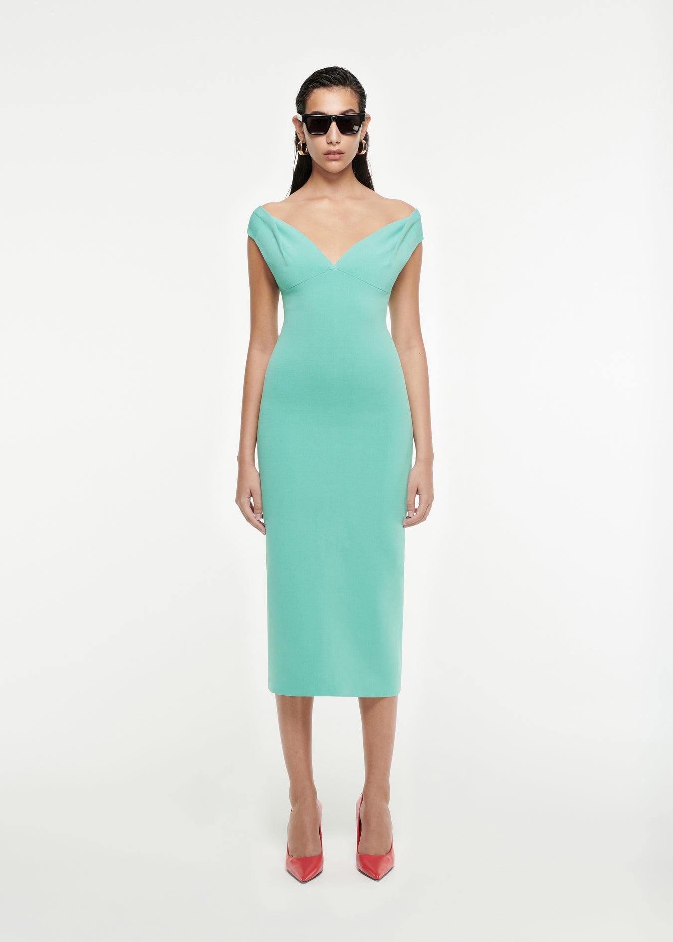 Woman wearing the Off-The-Shoulder Knit Midi Dress in Aqua