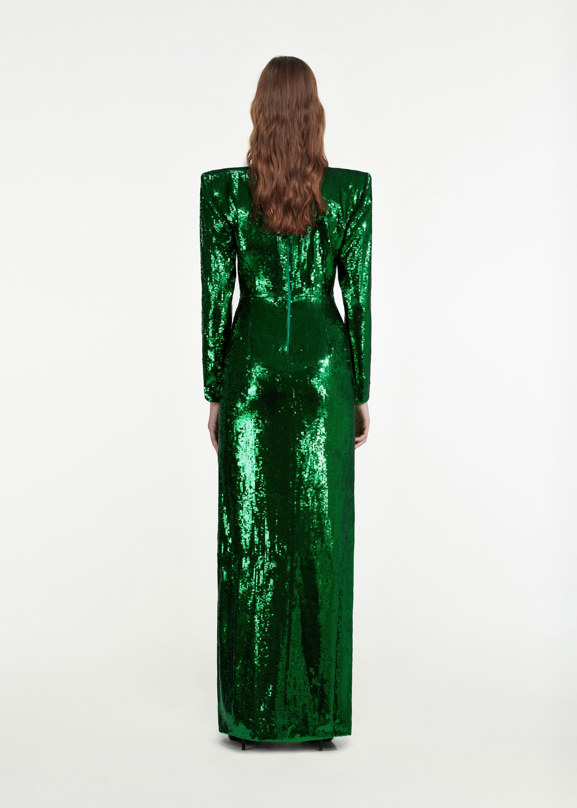 The back of a woman wearing the Twist-Front Sequin Gown in Green