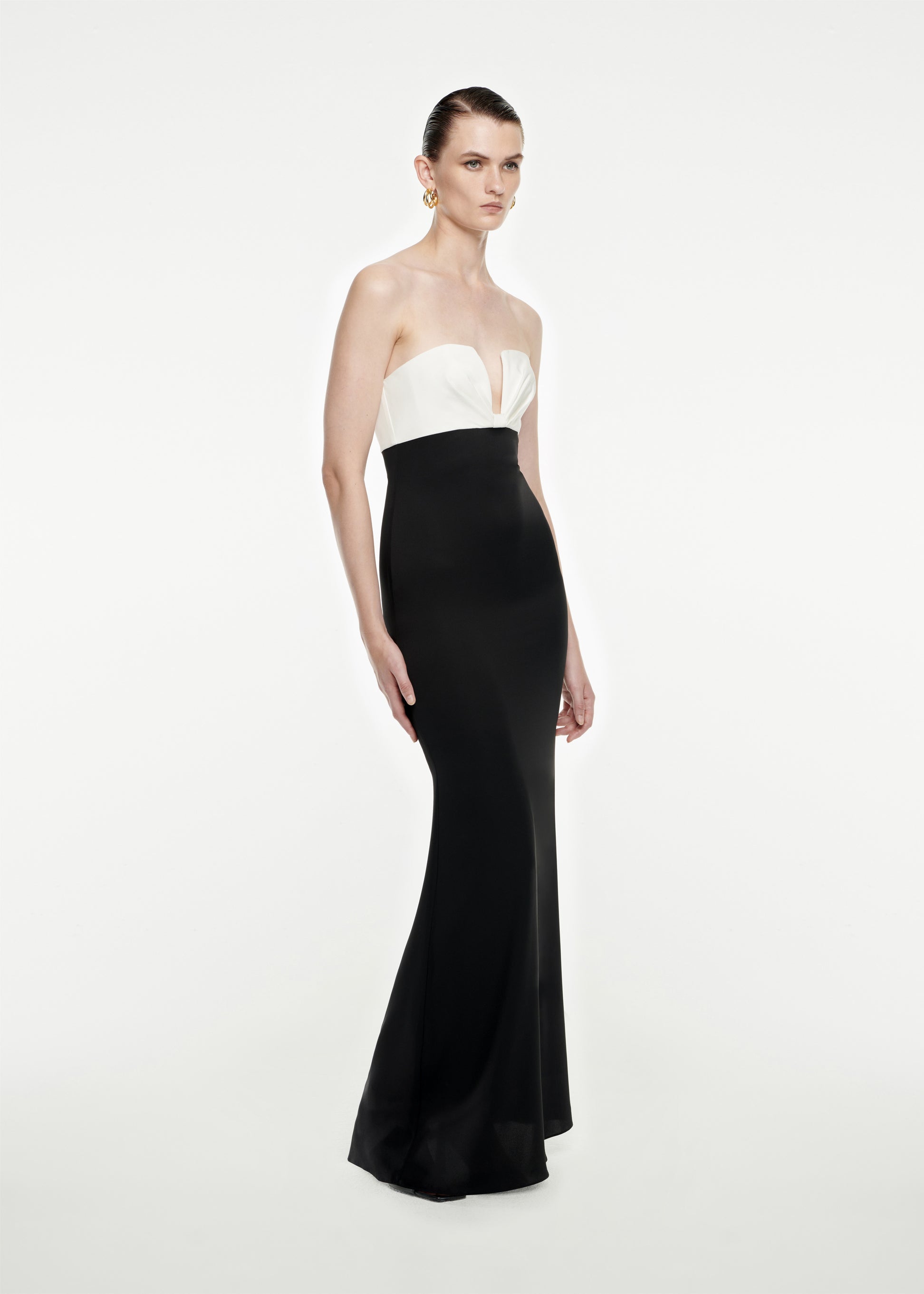 Woman wearing the Strapless Stretch Silk Crepe Maxi Dress in Black