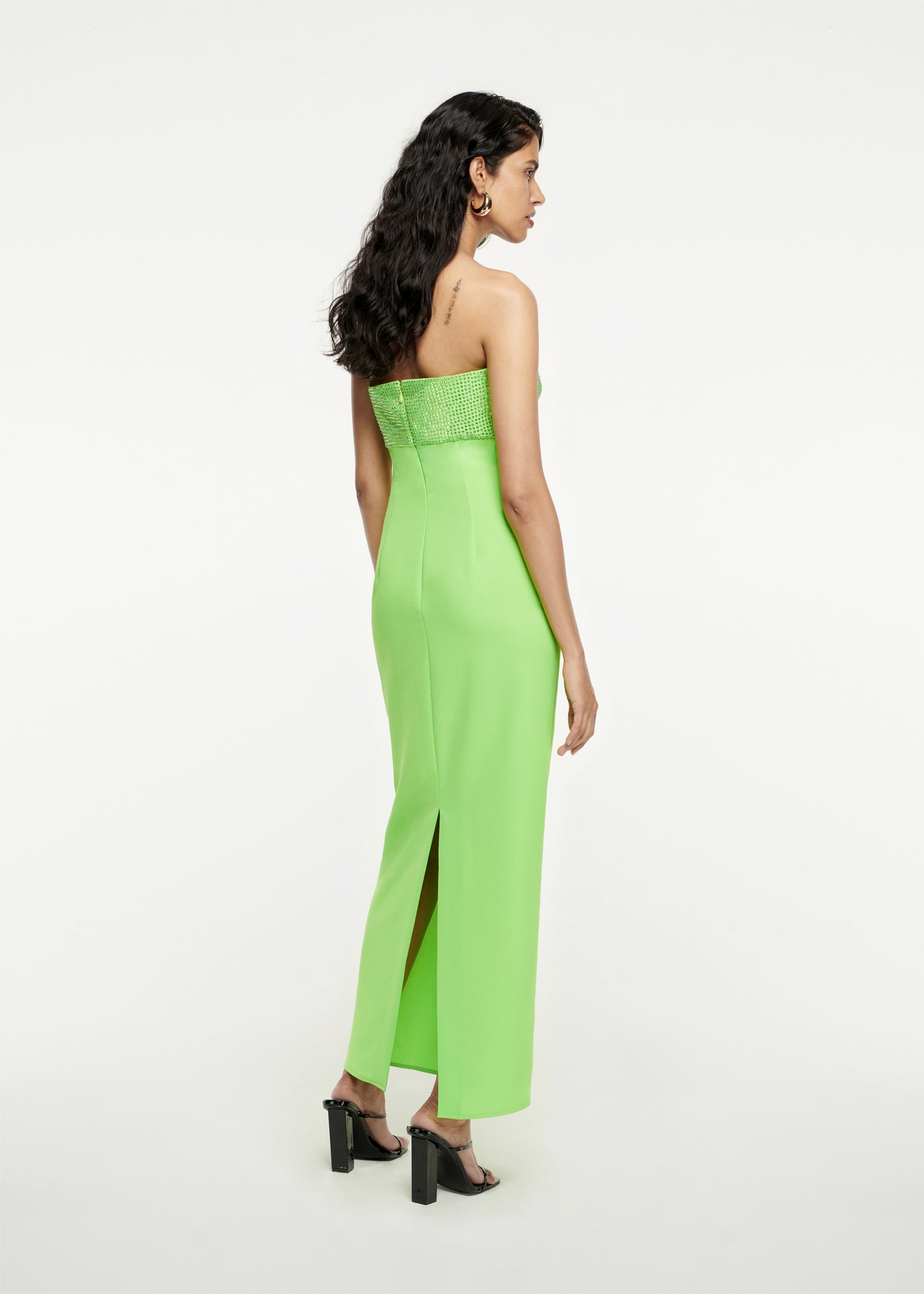 The back of a woman wearing the Diamante Stretch-Cady Maxi Dress in Green