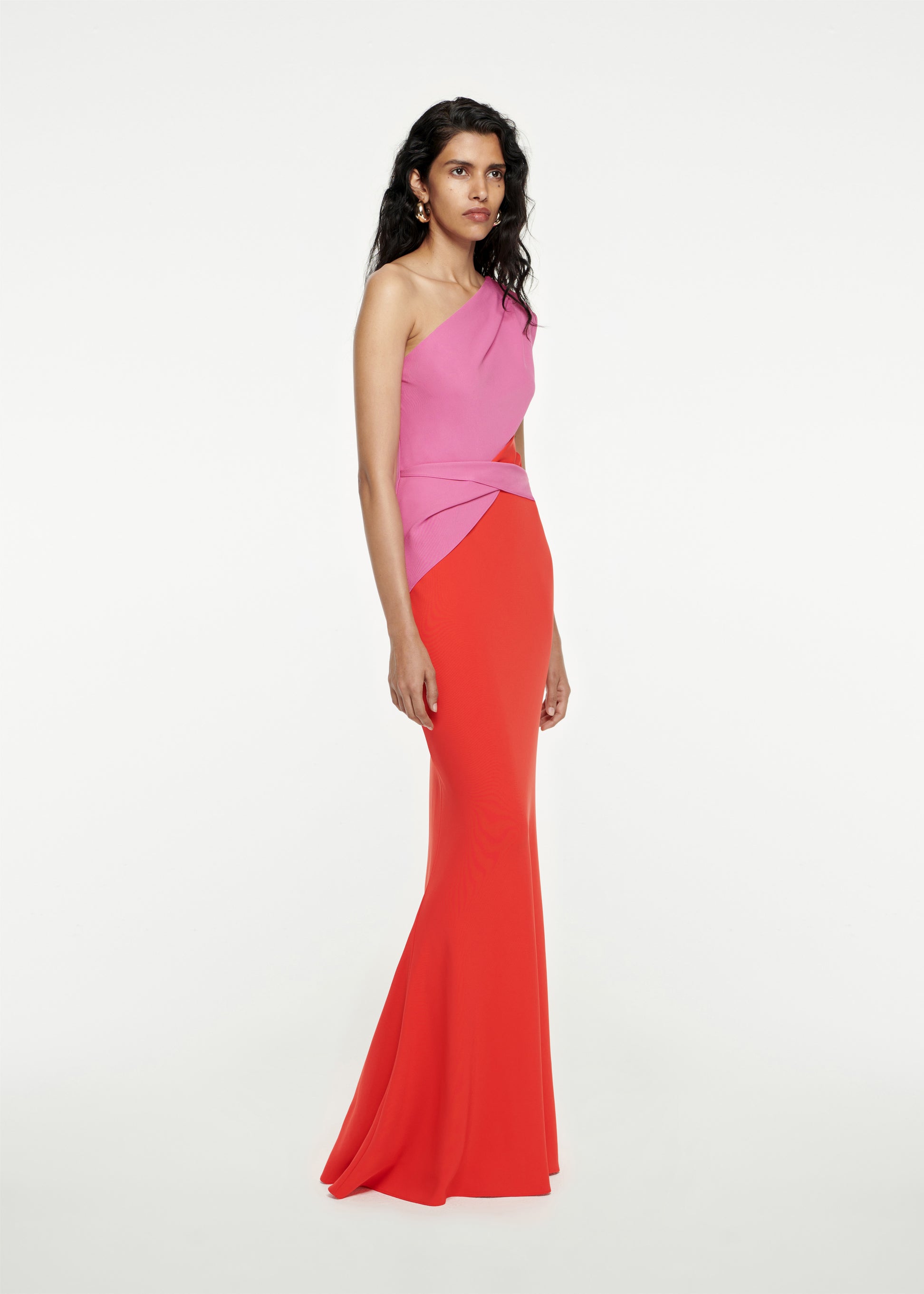 Woman wearing the Asymmetric Stretch-Cady Maxi Dress in Red