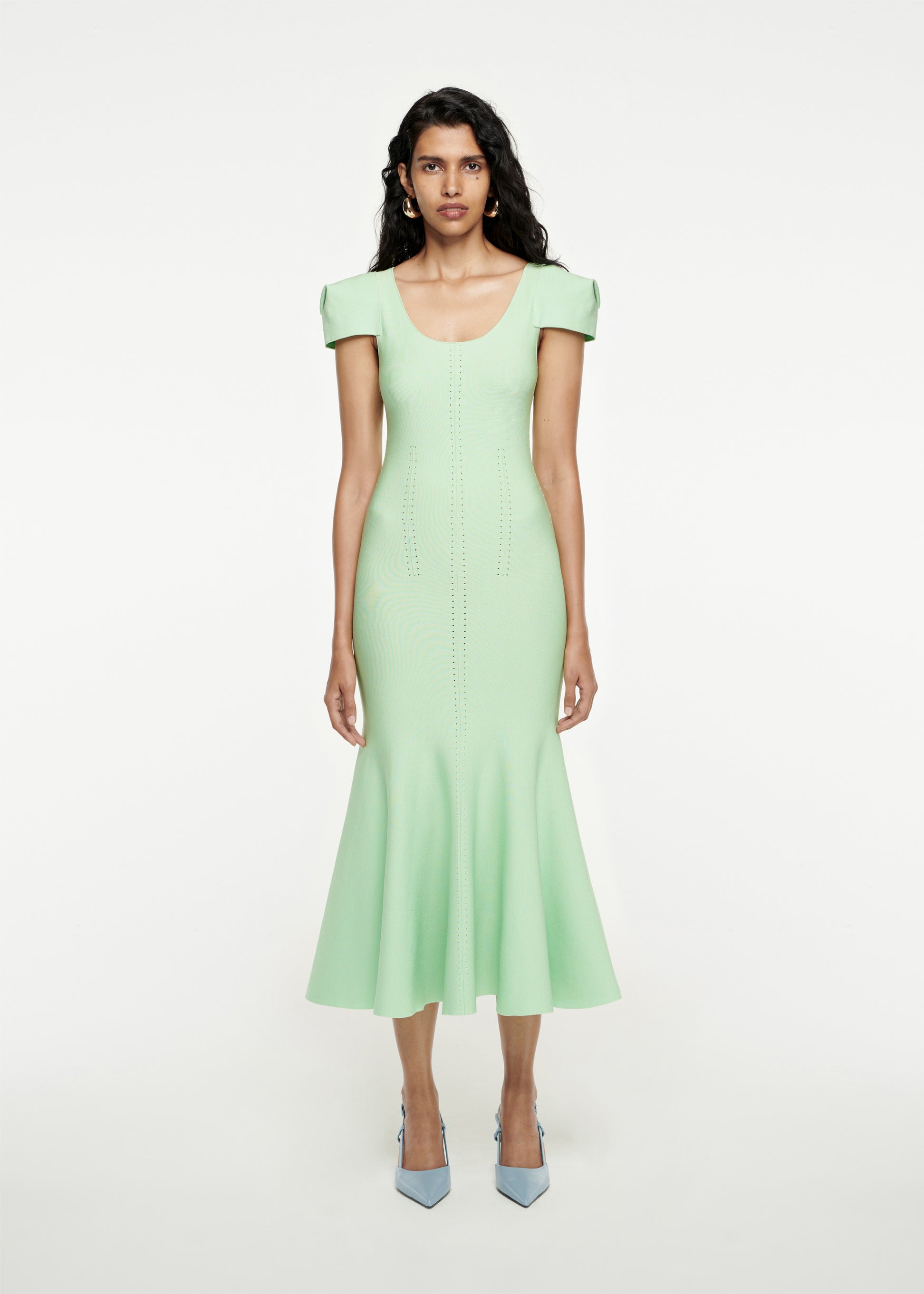 Woman wearing the Cap Sleeve Knit Midi Dress in Green