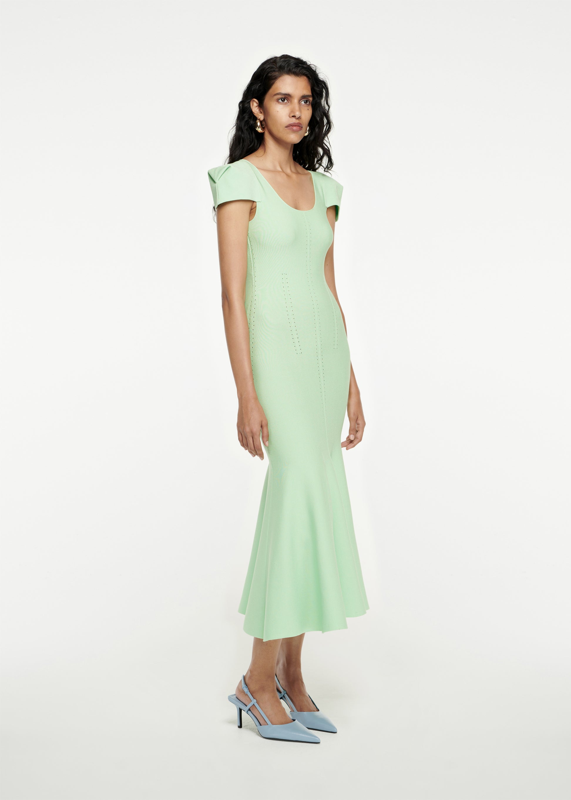 Woman wearing the Cap Sleeve Knit Midi Dress in Green