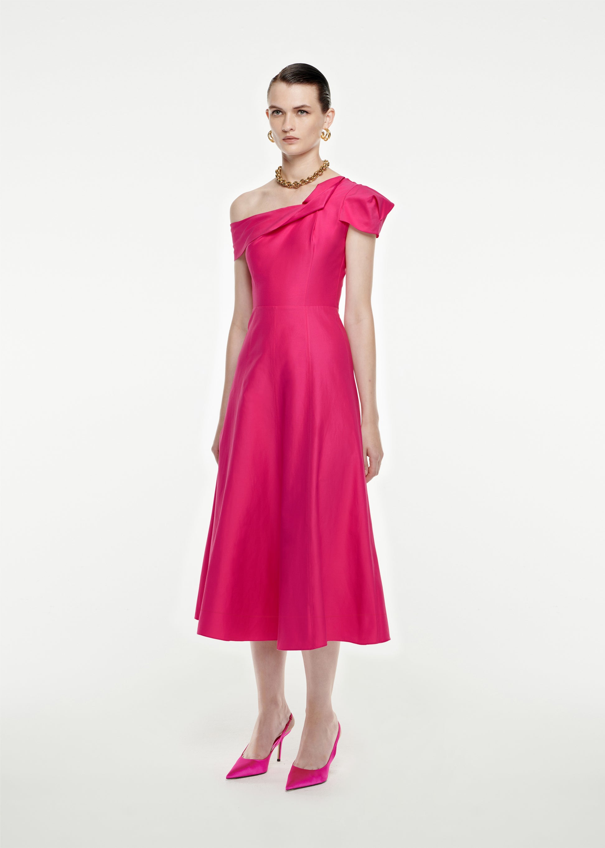 Woman wearing the Asymmetric Cotton Poplin Midi Dress in Pink