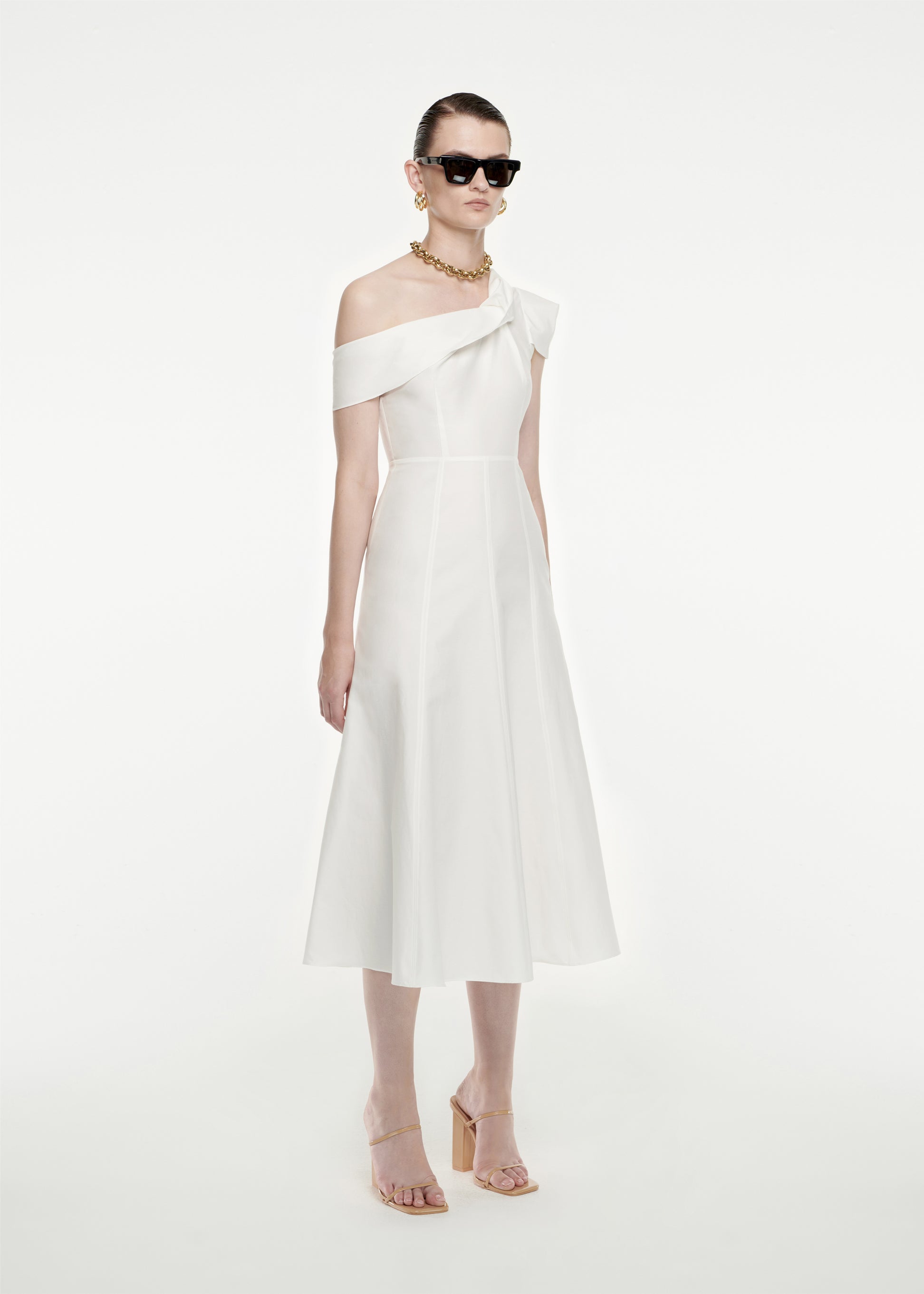 Woman wearing the Asymmetric Cotton Poplin Midi Dress in White